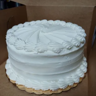 My favorite cake at Texas Star Bakery! White cake, white icing with strawberry filling between the layers.