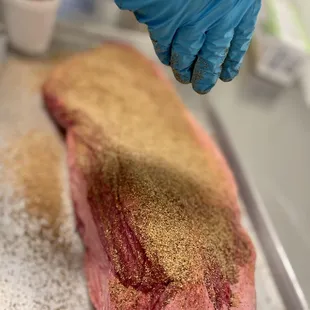 Delicious brisket being expertly prepared in our Texas Star BBQ kitchen. Mouthwatering perfection in the making! #texasbbq #brisket #foodpre