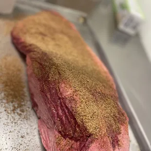 Delicious brisket being expertly prepared in our Texas Star BBQ kitchen. Mouthwatering perfection in the making! #texasbbq #brisket #foodpre