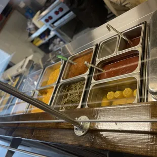 a display of hot dogs and condiments