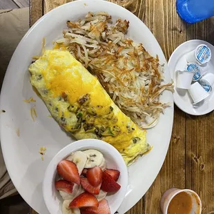Ranchero omelette bananas and strawberries and hash browns.