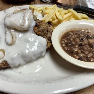 a plate of food with beans and gravy