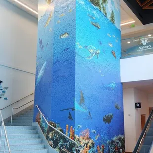 Mosaic column showing marine wildlife.