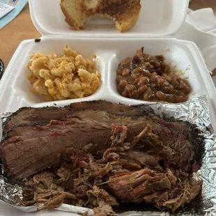 Two meat plate, brisket and pulled pork, Mac and cheese , bbq bean and toast.