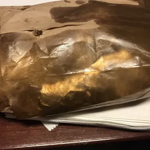 The barbacoa tacos are so greasy this is how your bag looks.