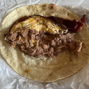 Bean, cheese and bacon on corn tortilla. 10/10
