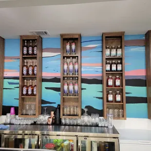 a bar with bottles of alcohol