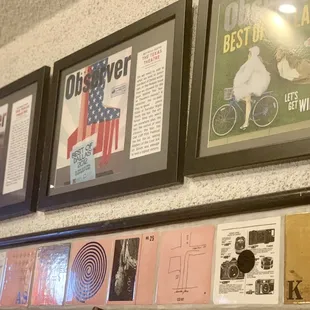 a number of framed memorabilias on a wall