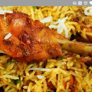 a plate of chicken and rice