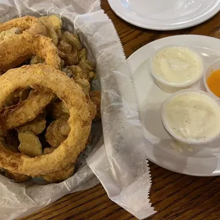 Triple app basket. Onion rings fried mushrooms and pickles. Huge serving and comes with ranch and that orange dipping sauce.