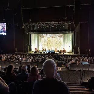a crowd of people watching a concert