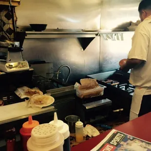 a man preparing food in a commercial kitchen