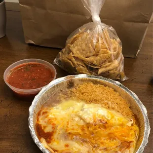 beef enchiladas with rice and refried beans and fresh chips with a great flavorful salsa