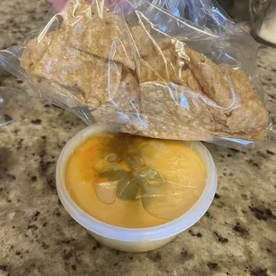 about 10 chips for the large queso to-go order. Definitely not what I get when I eat at the restaurant.  Disappointed