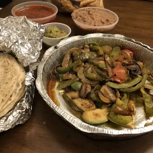 delicious Grilled veggie fajitas with excellent fresh made flour tortillas! Yum!