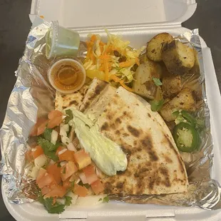 a meal in a styrofoam container