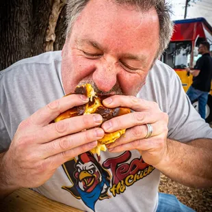 Happy Customer enjoying Big Tex sandwich