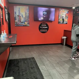 a man standing in front of a tv