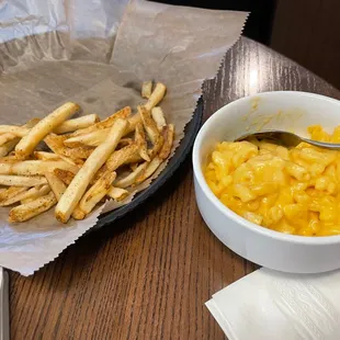 a bowl of macaroni and cheese fries and a bowl of macaroni and cheese fries