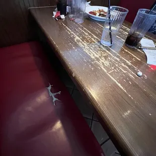 Ripped booth, scratched table