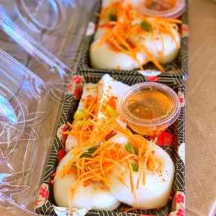 two trays of food on a table