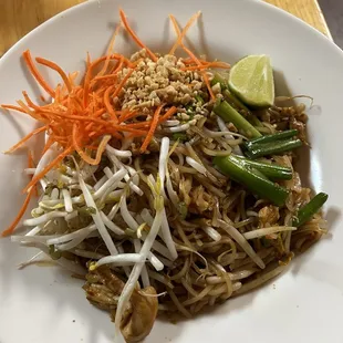 a plate of pad thai noodles