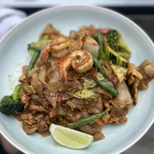 a person holding a plate of food