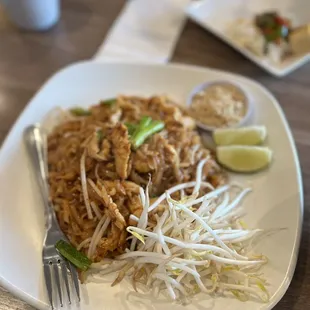 a plate of noodles and meat