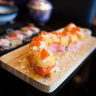 a sushi on a cutting board