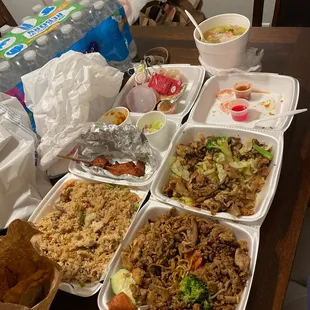 Left to right: combination fried rice, garlic chicken with noodles, chicken satay, pad se ew with chicken, and wonton soup.