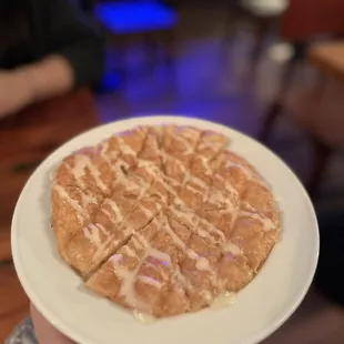 a person holding a plate of food