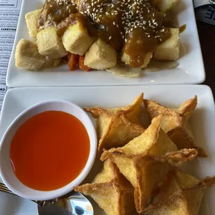 a plate of food and a bowl of sauce