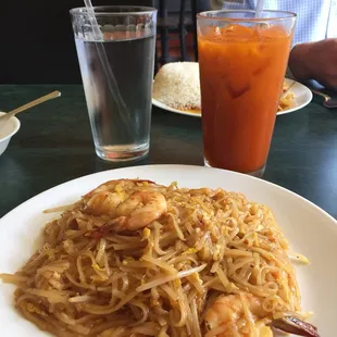 a plate of noodles and shrimp