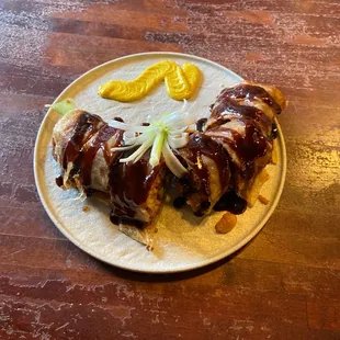 a plate of food on a wooden table