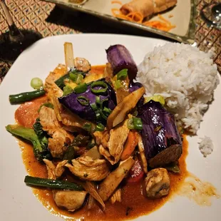 a plate of food with rice and vegetables
