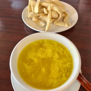 Egg Drop Soup, very yellow.  Added crunchy noodles for $1. So worth it.  They made the soup great.