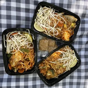 three takeout containers of food