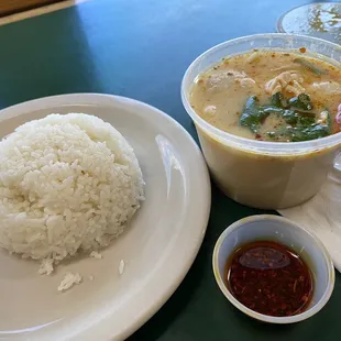 a plate of rice and a bowl of soup