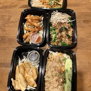 Pad thai (chicken), coconut shrimp, pad see ew (beef), pot stickers, fried rice (veggie). Not pictured: green curry
