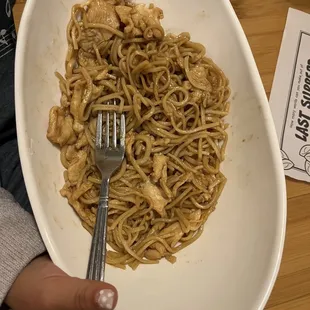 a plate of noodles and a fork