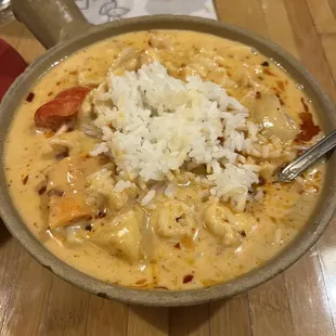 a bowl of soup and rice