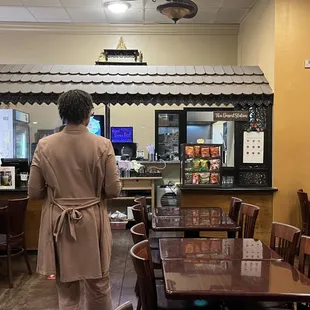 a woman standing in a restaurant