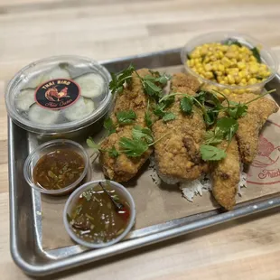 Ginger pickles, red curry corn, Thai fried chicken. Both of the sauces are great but my favorite is the tamarind.