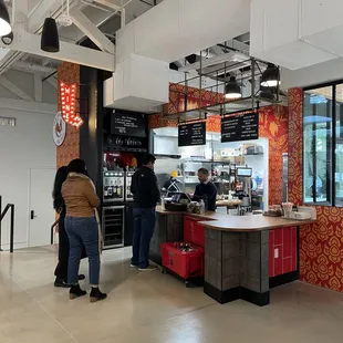 customers at the counter of a restaurant