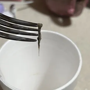 a fork sticking out of a cup