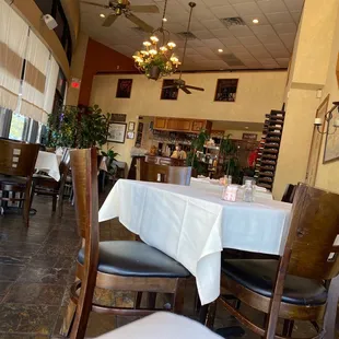 a dining area with tables and chairs