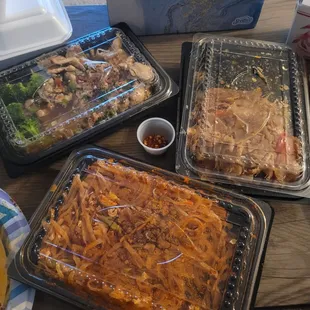 three trays of food on a table