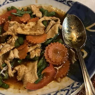 a plate of food with a spoon