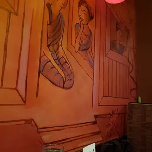 a painting on the wall of a restaurant