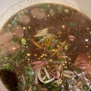 a bowl of beef and vegetable soup